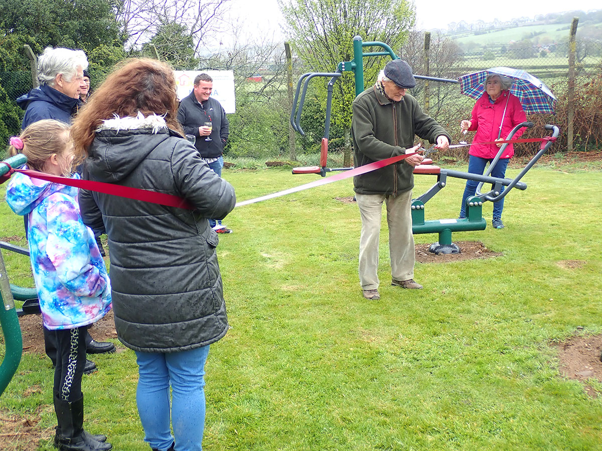 Mr Philip Barritt cuts the ribbon to open the gym